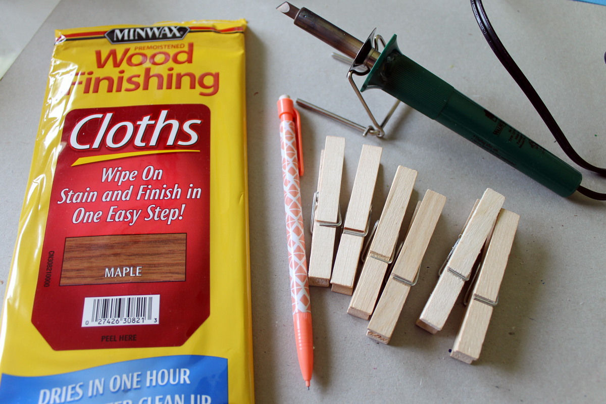 bag of clothespins and wood burning tool